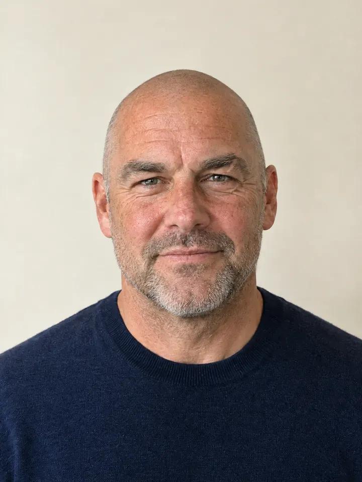 The same man with a shaved head, made by an AI try-on