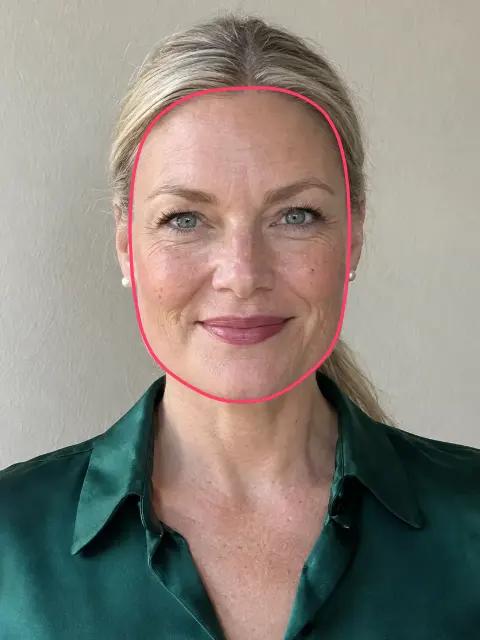 A woman with a square face, its outline drawn on her face