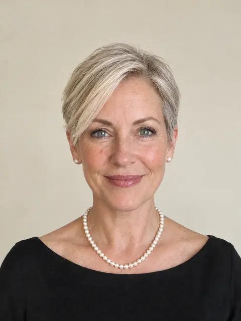 The same woman with a side-swept pixie cut