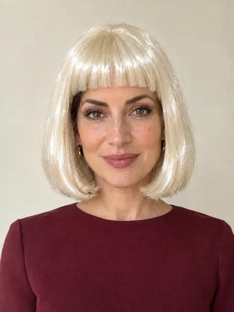The same woman in a shiny synthetic bob wig