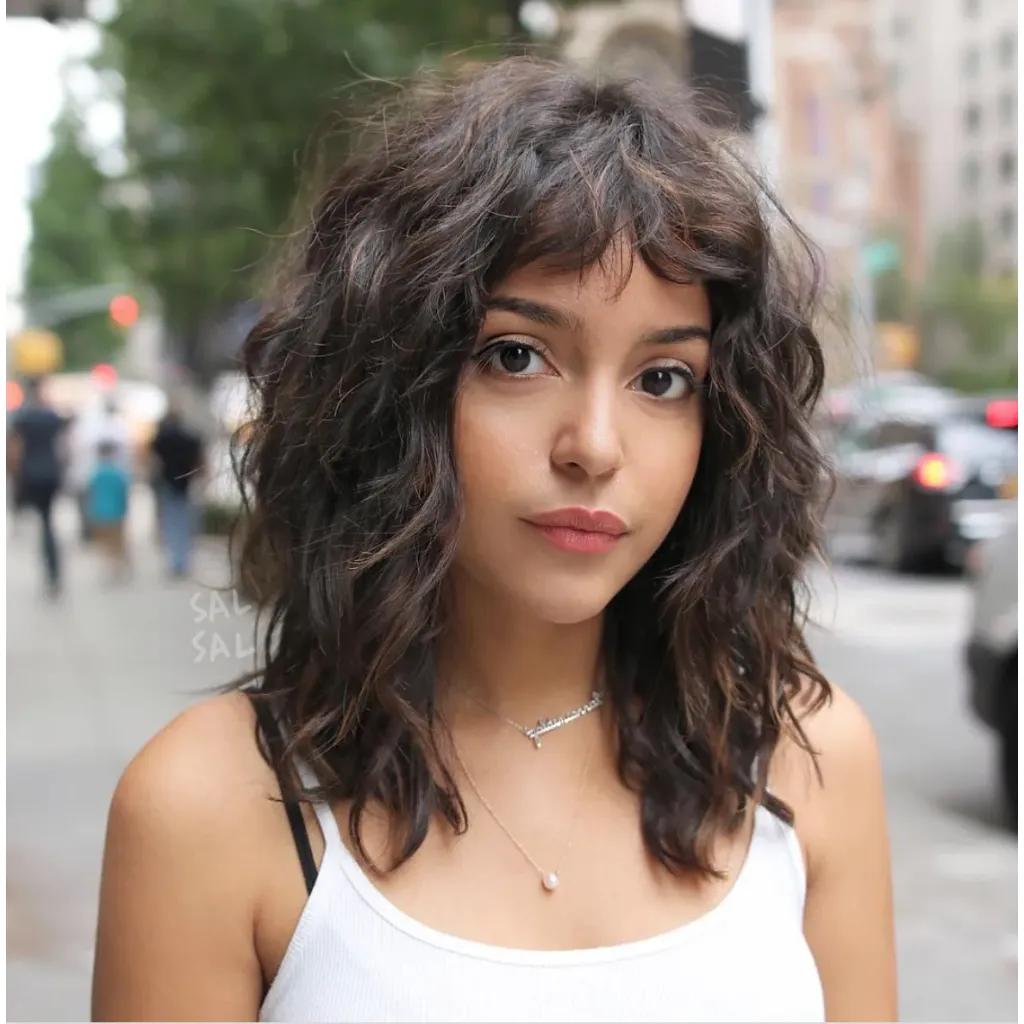 Curly Curtain Bangs hairstyle