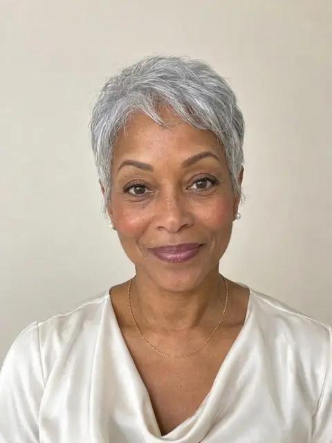 A Black woman in her sixties with a silver pixie cut
