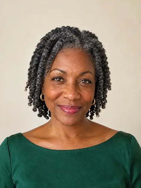 A Black woman in her fifties with chin-length two-strand twists